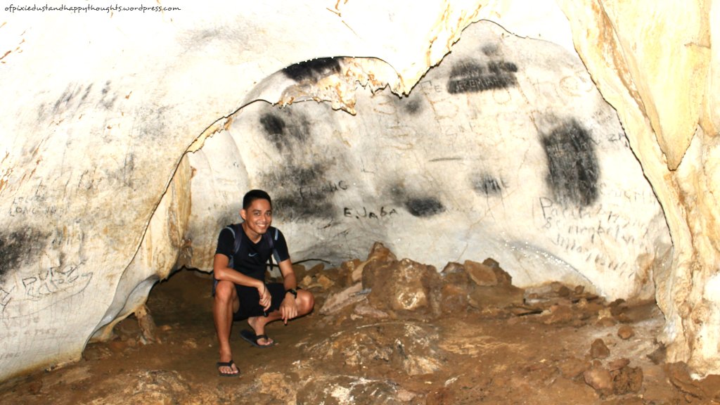 The tiny hole behind him is where we crawled in after I took this picture. :D