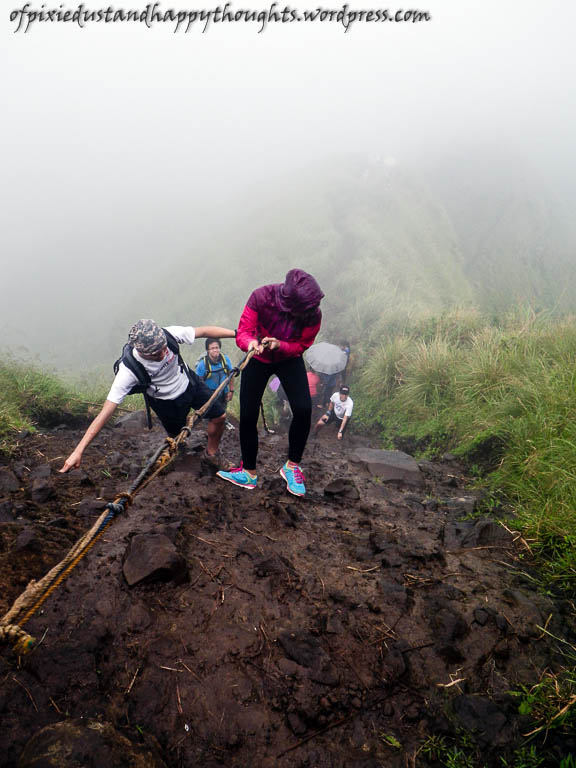 Dee was the first one to rappel among the three of us. It was raining hard by then.