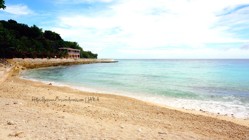 the other side of the beach with coarser sand and built-in stairs at the sides